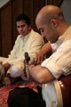 Tarun Jasani tunes his Sarod. There are two sets of tuning pegs, the further ones for the longer strings, which are spaced further apart, and the closer ones for a second set of strings that are close together.